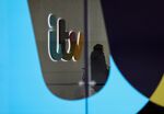 A visitor stands in the reception area of the ITV Plc headquarters and television studios in London.