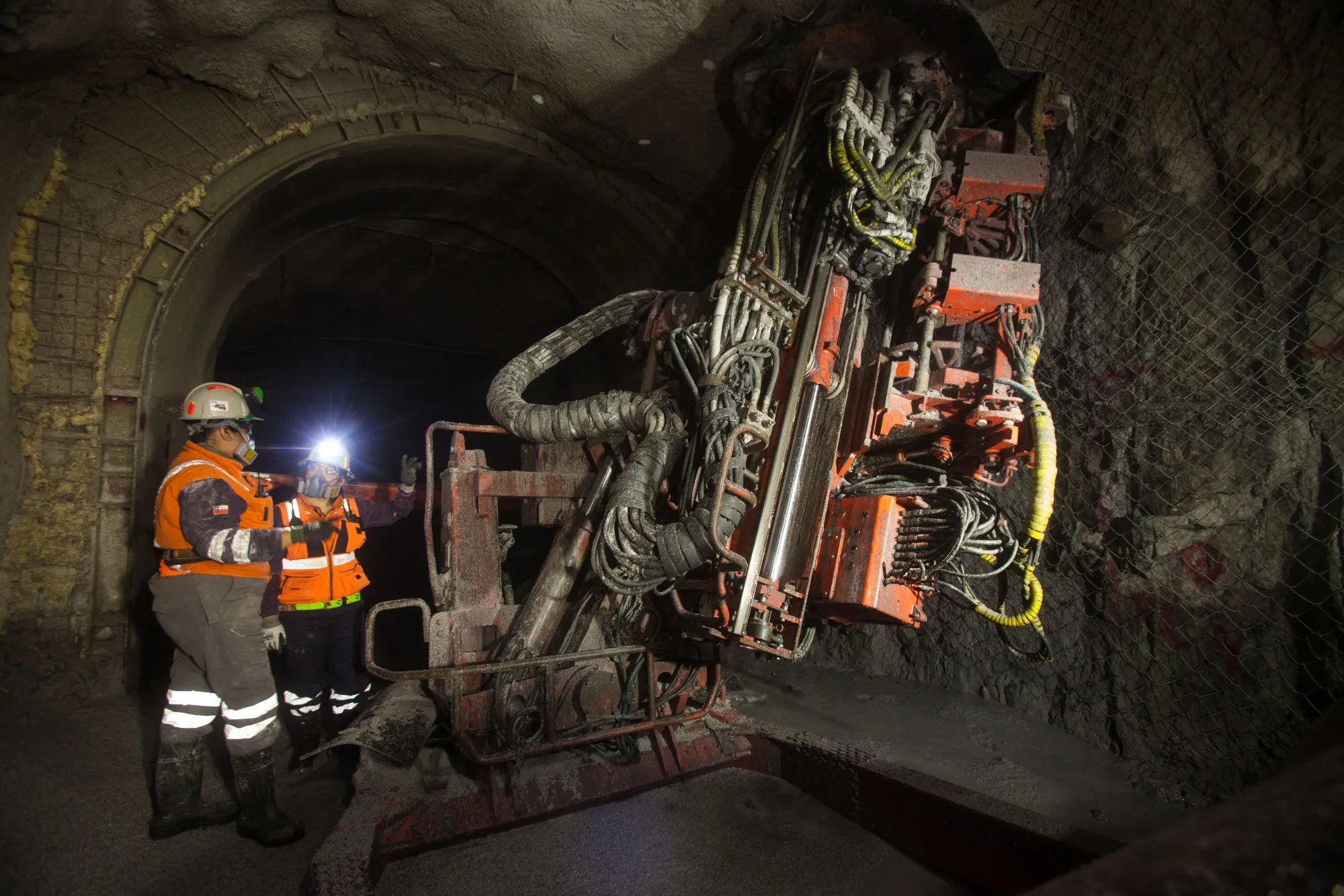 Employees use a machine to extract copper in a mine in Calama, Chile.&nbsp;