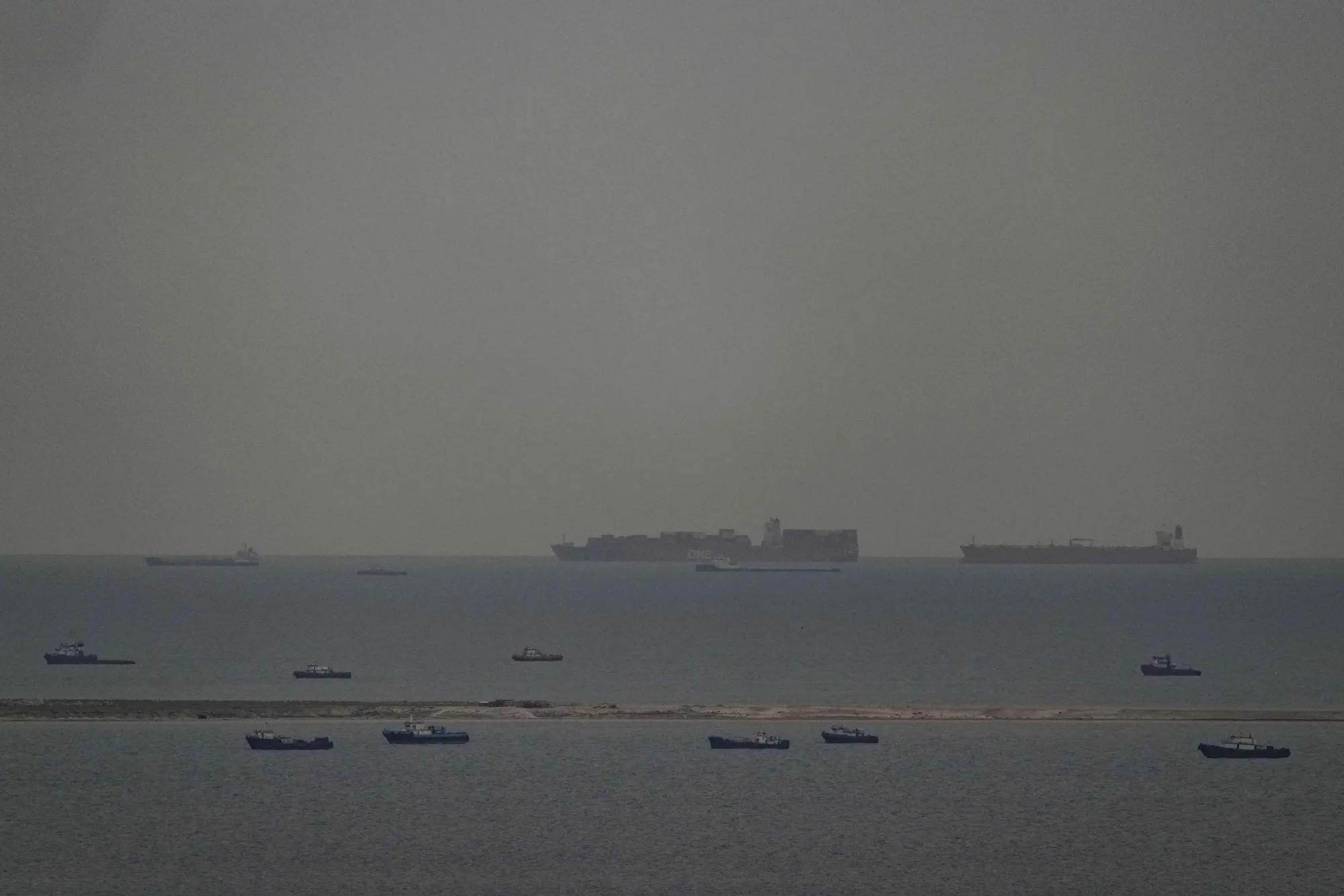 Cargo ships in the Arabian Gulf move toward the Strait of Hormuz near the United Arab Emirates on March 27.&nbsp;