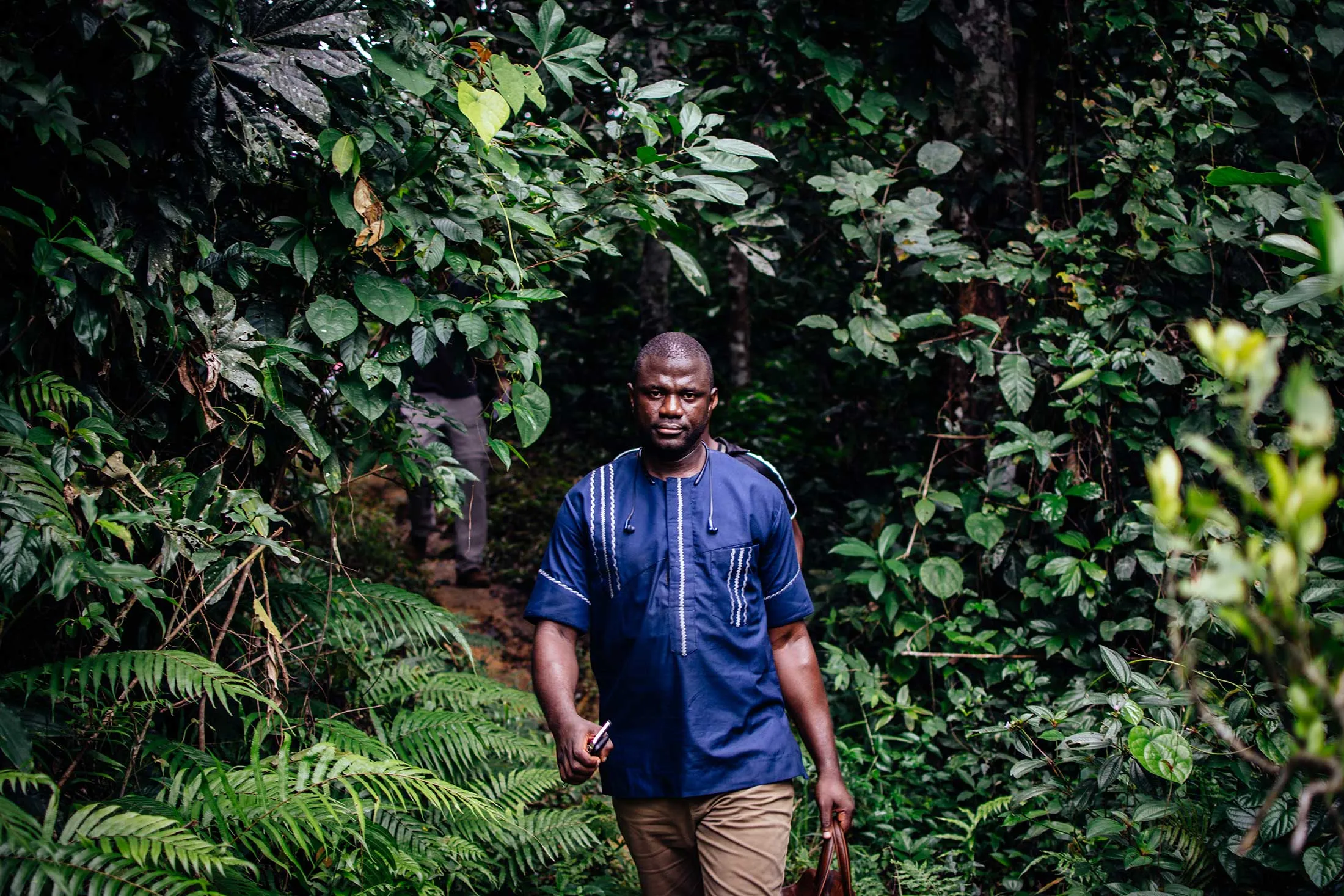 Emmanuel Momoh, the first owner of the Peace Diamond, on a trek to the pit where it was found.