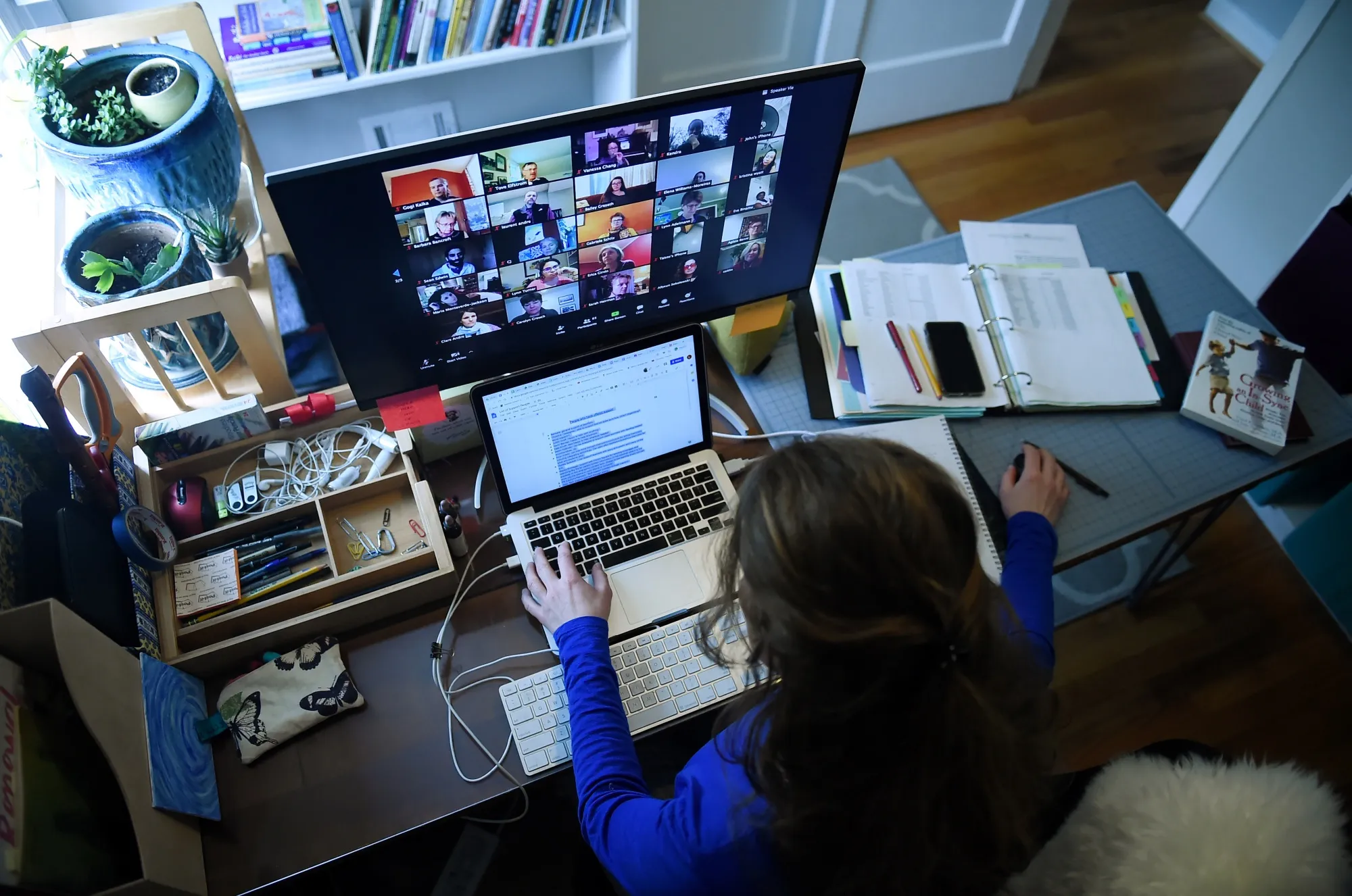 A lower school substitute teacher works from her home due to the Coronavirus outbreak in Arlington, Virginia.