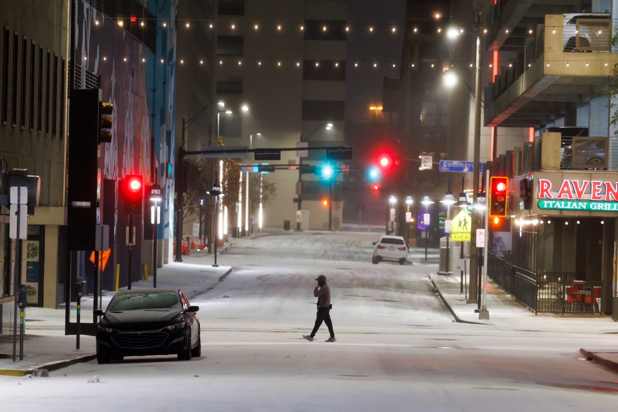 A pedestrian during a winter storm in Dallas, Texas, US, on Saturday, Jan. 24, 2026. A sprawling winter storm has grounded more than 14,500 flights around the US, triggered a grid emergency and knocked out power to thousands, all while threatening to drop a foot of snow on New York City and the rest of the Northeast corridor on Sunday.