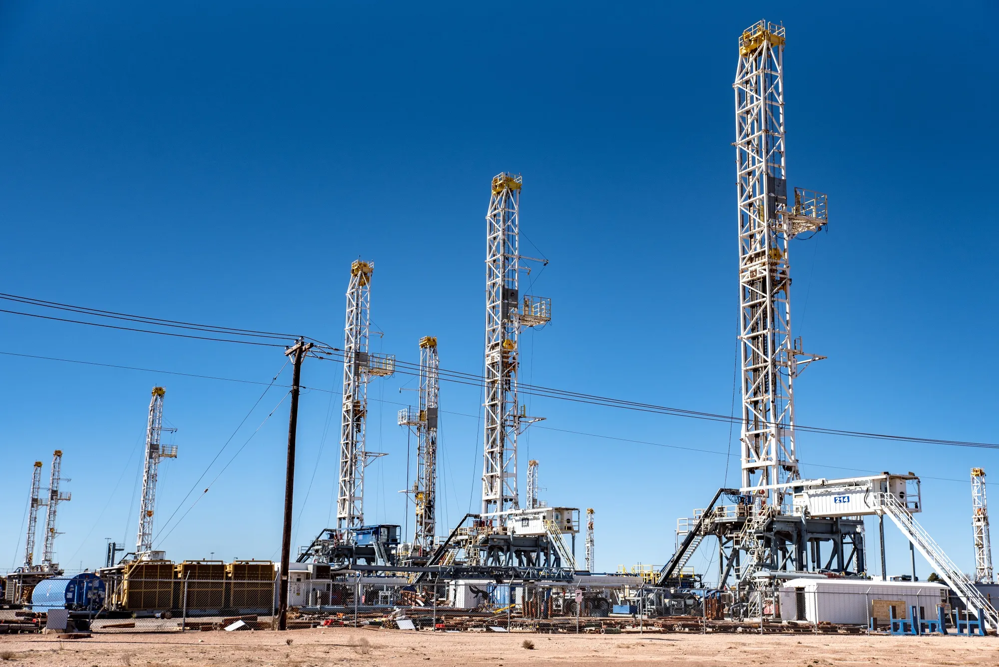 Oil rigs stand in the Permian Basin area of Odessa, Texas.