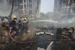 Firefighters at the Air India crash site in Ahmedabad, on June 12.