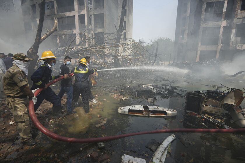 Firefighters at the Air India crash site in Ahmedabad, on June 12.