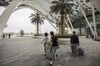 People walk with their luggage through the CDF Mall, a duty-free shopping complex operated by China International Travel Service Co. (CITS), in Sanya, Hainan province, China, on Wednesday, March 14, 2018. Chinese President Xi Jinping will speak at Hainan island's Boao Forum on April 10, and investors hope the leader will come bearing gifts: new tax concessions to attract more tourists to this tropical destination nestled along the South China Sea near the Vietnam border.