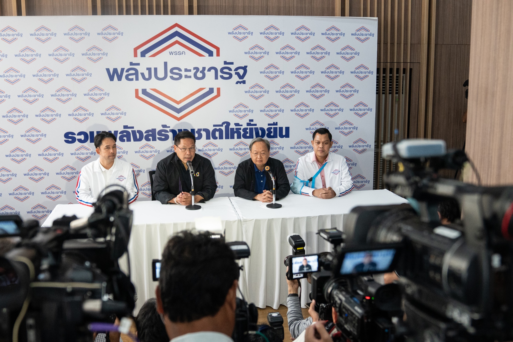 Uttama Savanayana,&nbsp;second left, speaks during a news conference at the military-backed party's headquarters in March.