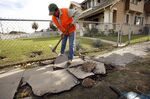 A damaged sidewalk under repair in Los Angeles, which is afflicted with thousands of miles of cracked walkways.