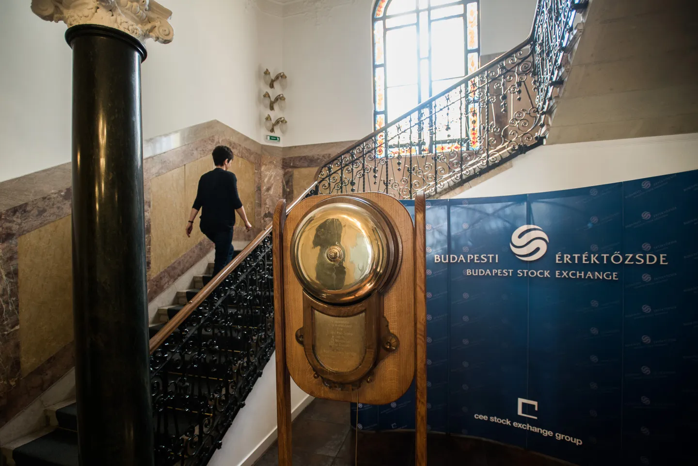 An employee walks up the stairway inside the Budapest stock exchange in Budapest, Hungary, on Wednesday, May 15, 2013. Hungary's economy posted quarterly growth in the first three months of the year for the first time since 2011, helped by an increase in construction output.