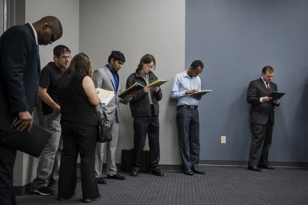 Job seekers wait in line to enter the Choice Career Fair in San Antonio, Texas, U.S.
