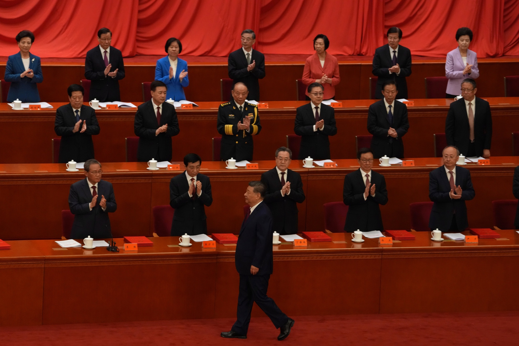Chinese President Xi Jinping, front, attends a ceremony at the Great Hall of the People in Beijing on July 1. Photographer: Ng Han Guan/AP Photo