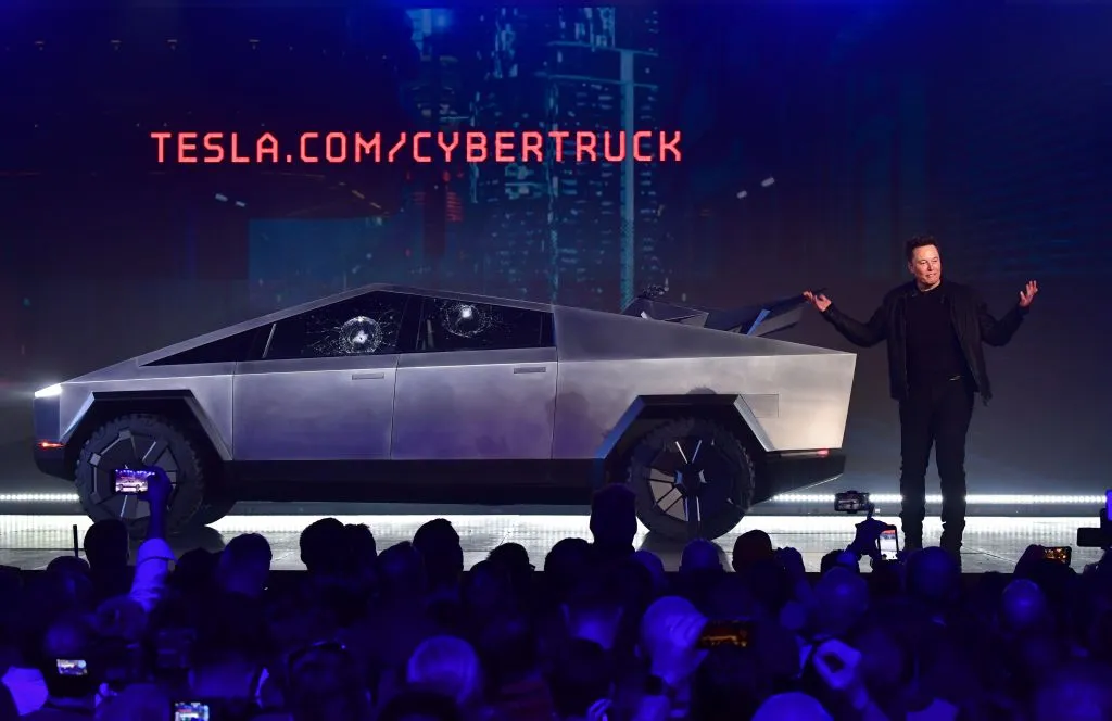 Elon Musk speaks in front of a Cybertruck with shattered windows, after a failed resistance test, at Tesla Design Center in Hawthorne, California in 2019. 