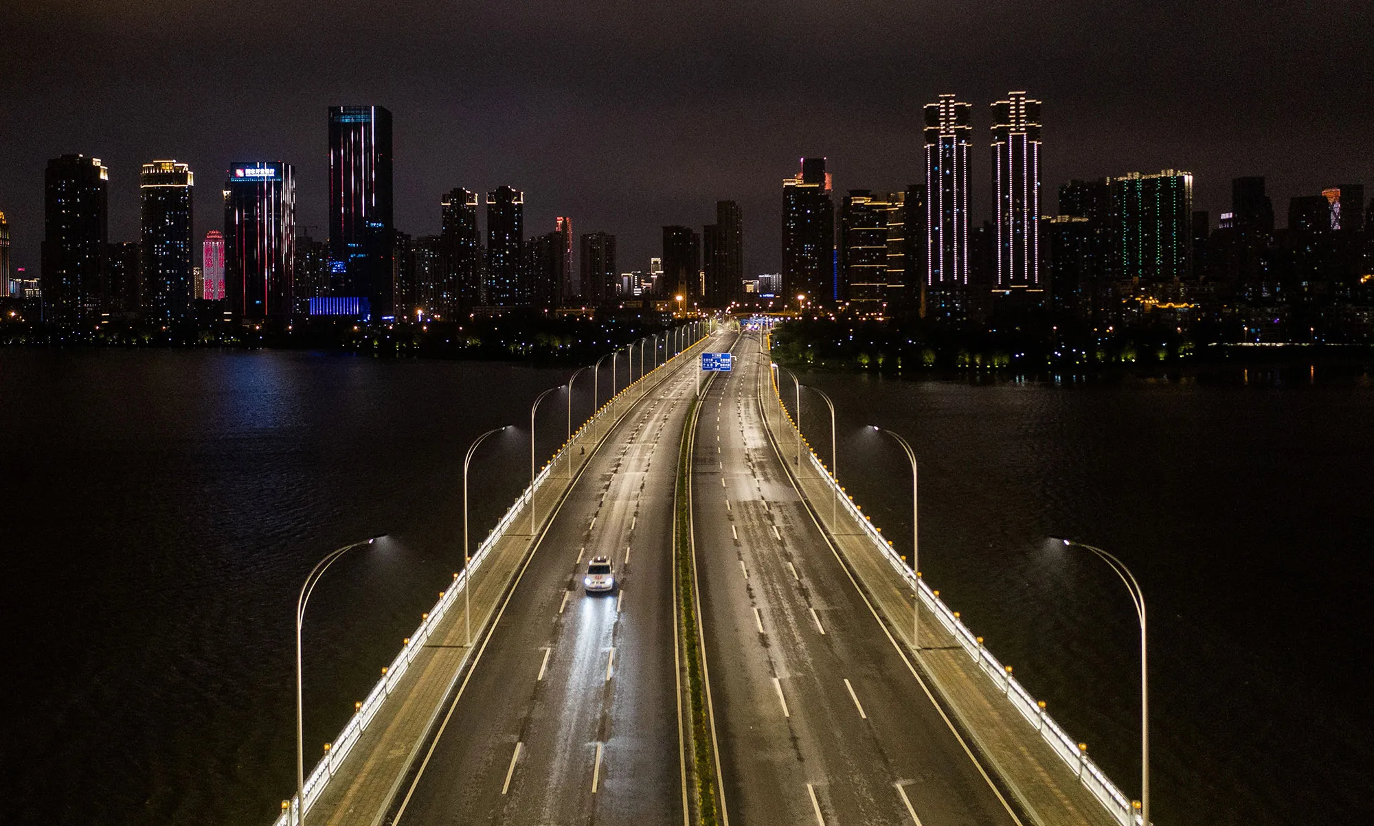 A single car moves across a bridge&nbsp;in Wuhan, China on March 26.