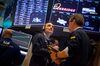 Traders work on the floor of the New York Stock Exchange (NYSE) in New York, U.S., on Friday, April 6, 2018. U.S. stocks fell and Treasuries rose as investors assessed the latest threat to the global trade order and a disappointing jobs report.