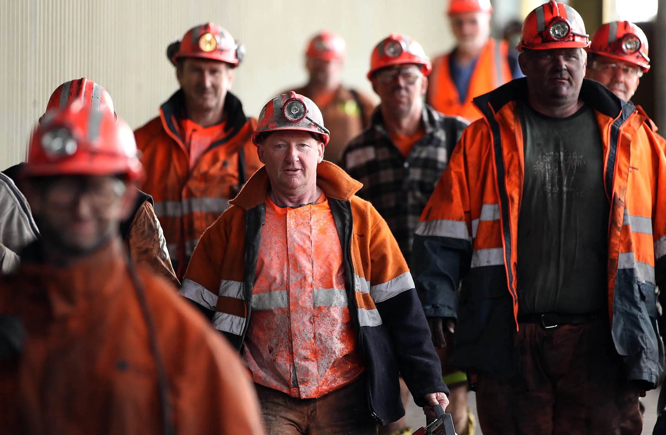 Miners arrive back at the surface after finishing their shift at Centennial Coal Co.'s Myuna mine in Myuna, Australia, on Monday, Aug. 2, 2010. Banpu Pcl, Thailand's biggest coal producer, agreed to buy the rest of Centennial Coal Co. for A$2 billion ($1.7 billion) in the nation's biggest overseas takeover to secure supplies as prices climb.
