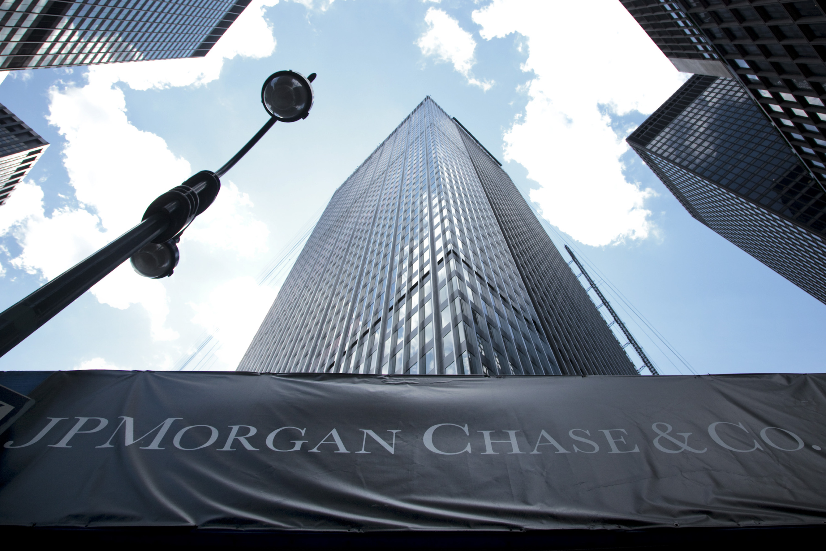 Signage hangs outside the headquarters of JPMorgan Chase &amp; Co. in New York,.