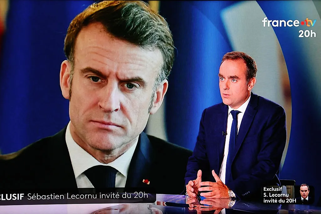 Sebastien Lecornu and an image of Emmanuel Macron.