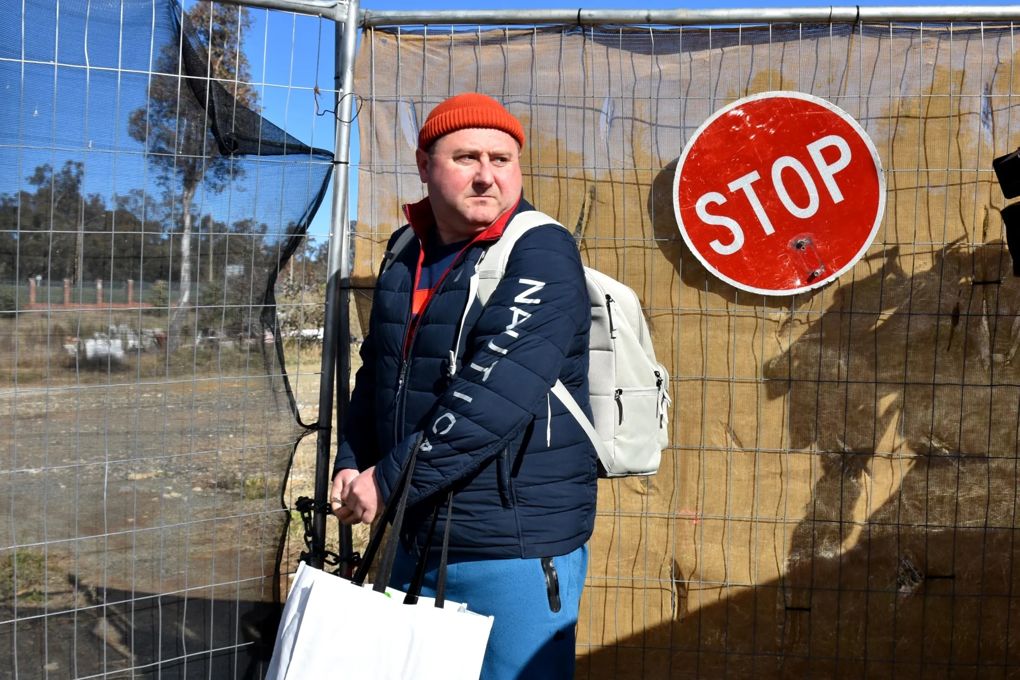 A Russian diplomat leaves the site near Parliament House in Canberra on June 26.