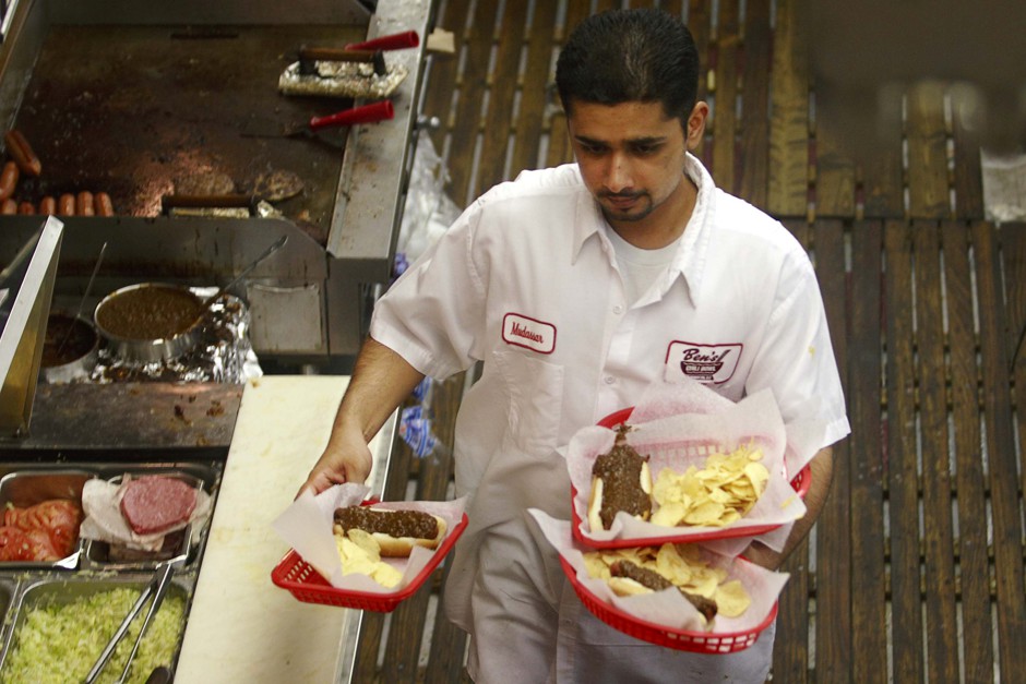 A waiter hustles at the iconic Ben's Chili Bowl in Washington, D.C.