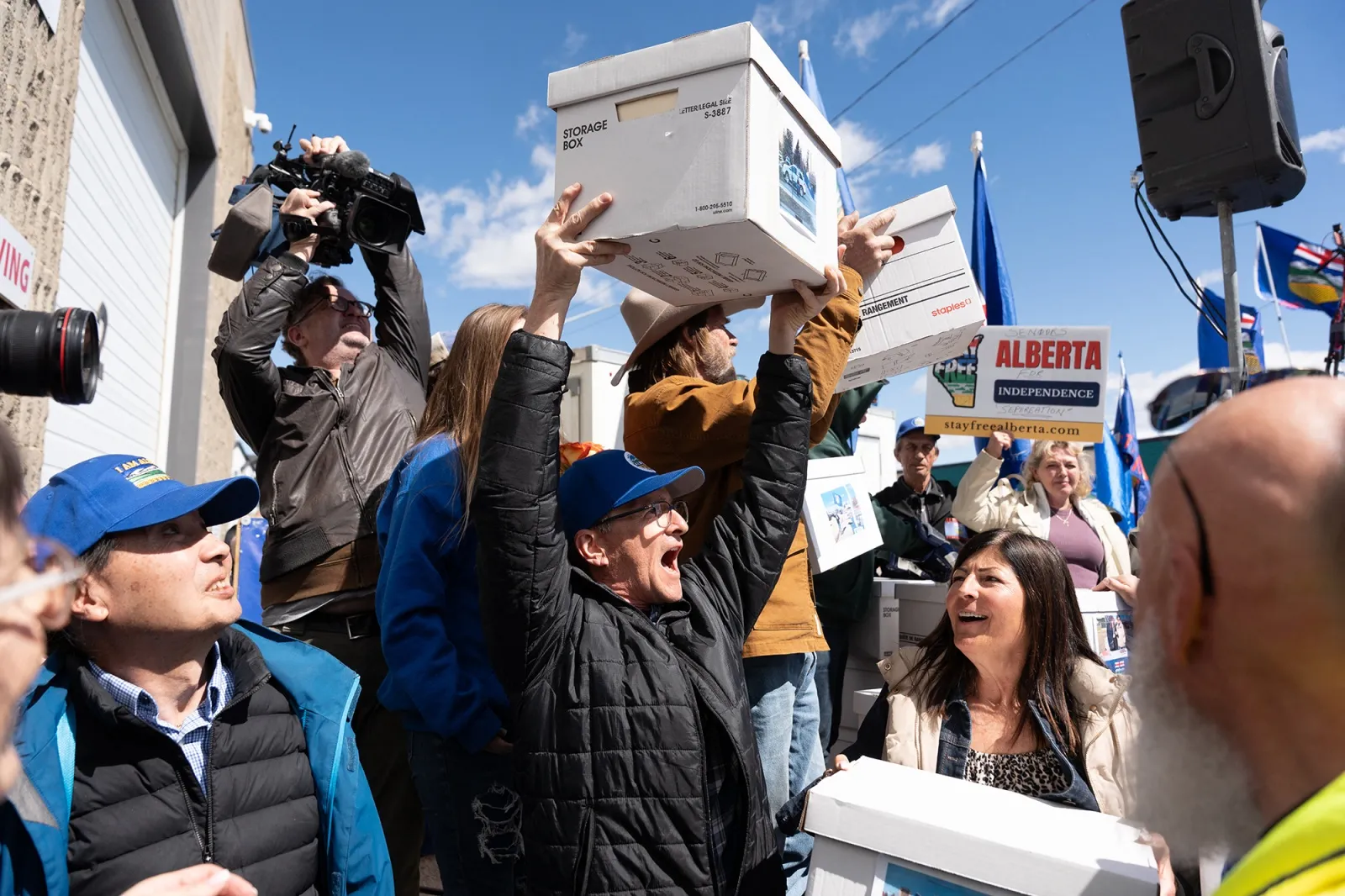 A separatist supporter holds a box during a rally&nbsp;in front of the Elections Alberta headquarters in Edmonton on May 4.