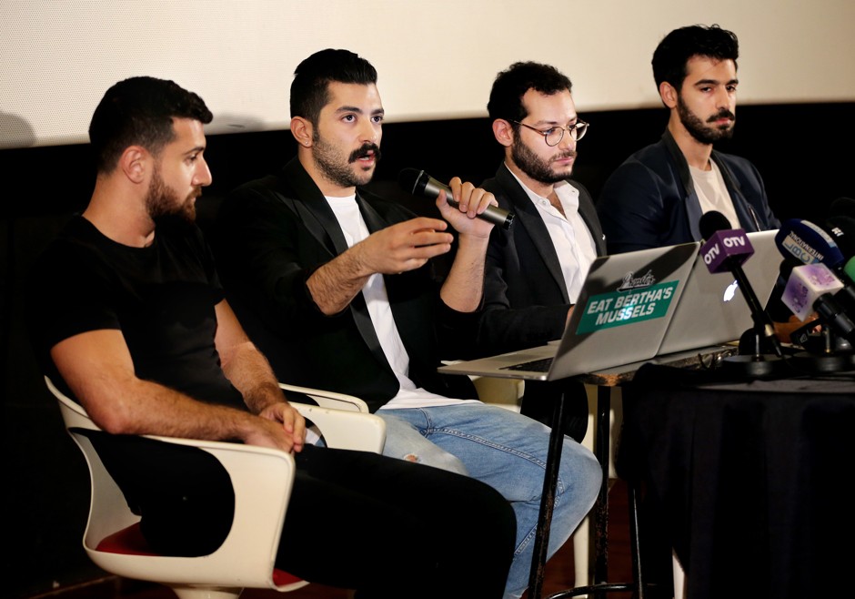 Mashrou' Leila's lead singer Hamed Sinno, flanked by fellow band members, speaks at a press conference earlier this year. 