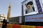 A huge picture of Iranian supreme leader Ayatollah Ali Khamenei is erected next to a Qadr-F (L) missile, displayed at a square in southern Tehran, on September 26, 2011 to mark the 'Sacred Defence Week' that commemorates Iran's bloody eight-year war with Iraq. AFP PHOTO/ATTA KENARE (Photo credit should read ATTA KENARE/AFP/Getty Images)
