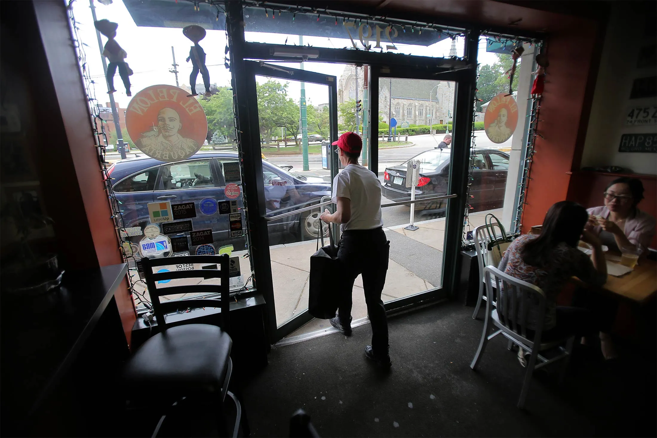 A delivery driver for Grubhub&nbsp;picks up an order from a restaurant in Boston, Mass.
