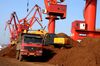 --FILE--An excavator loads rare earth onto a truck on a quay at the Port of Lianyungang in Lianyungang city, east Chinas Jiangsu province, 4 November 2012. China is preparing to scrap controversial tariffs and quotas on the export of rare earth materials after a World Trade Organization (WTO) panel branded them discriminatory earlier this year, according to reports. China is responsible for more than 90 percent of global rare earth production, giving it a chokehold over the supply of 17 elements with a wide range of uses in high-tech sectors such as defence and renewable energy. The move to comply with WTO rules would reflect a tactical adjustment for Beijing, but its long-term plan to improve pricing power and gain market share in lucrative downstream industries is expected to remain unchanged.