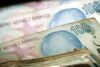 Turkish 100 lira bank notes are seen on a counting machine in this arranged photograph in Istanbul, Turkey, on Sunday, Oct. 23, 2011. The central bank raised the overnight repo lending rate to 12 percent from 8 percent on Oct. 20 as it sought to boost the value of the lira, which has slumped 15.5 percent this year, the second-worst performance in emerging markets after the South African rand.