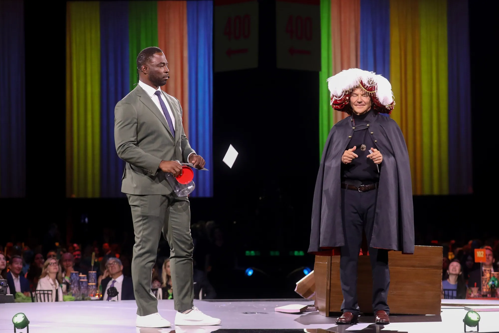 Former New York Giant Justin Tuck, left, and Paul Tudor Jones dressed as Carnac the Magnificent during Monday’s Robin Hood Benefit.
