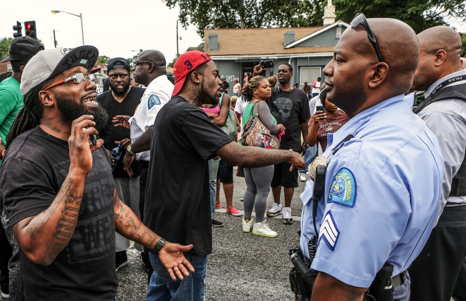 Protesters face off with St. Louis police in August 2015 after a shooting incident, almost a year after Michael Brown was killed by police in nearby Ferguson, Missouri.