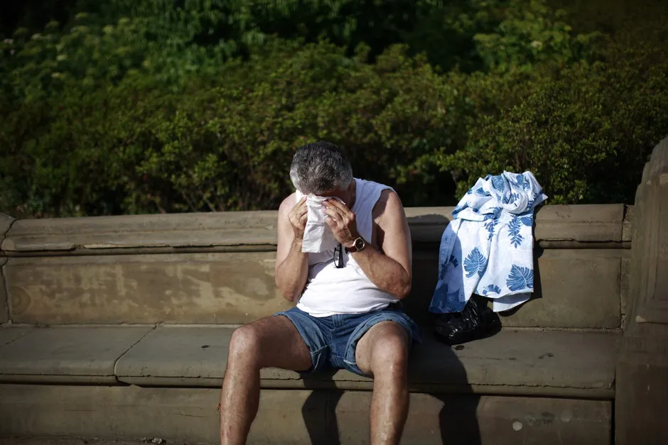 A man sweats in New York's Central Park in July 2012.