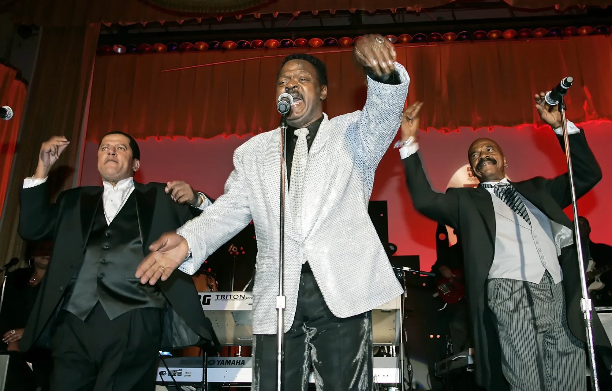 The Delfonics, from left, Randy Cain, William "Poogie" Hart, and brother Wilbert Hart, perform at the Rhythm & Blues Foundation's 14th annual Pioneer Awards in Philadelphia on June 29, 2006, where they received an award. Hart, a founder of the Grammy-winning trio, has died at age 77. His son Hadi told The New York Times that Hart died July 14, 2022, at Temple University Hospital in Philadelphia from complications during surgery. (AP Photo/George Widman, File)