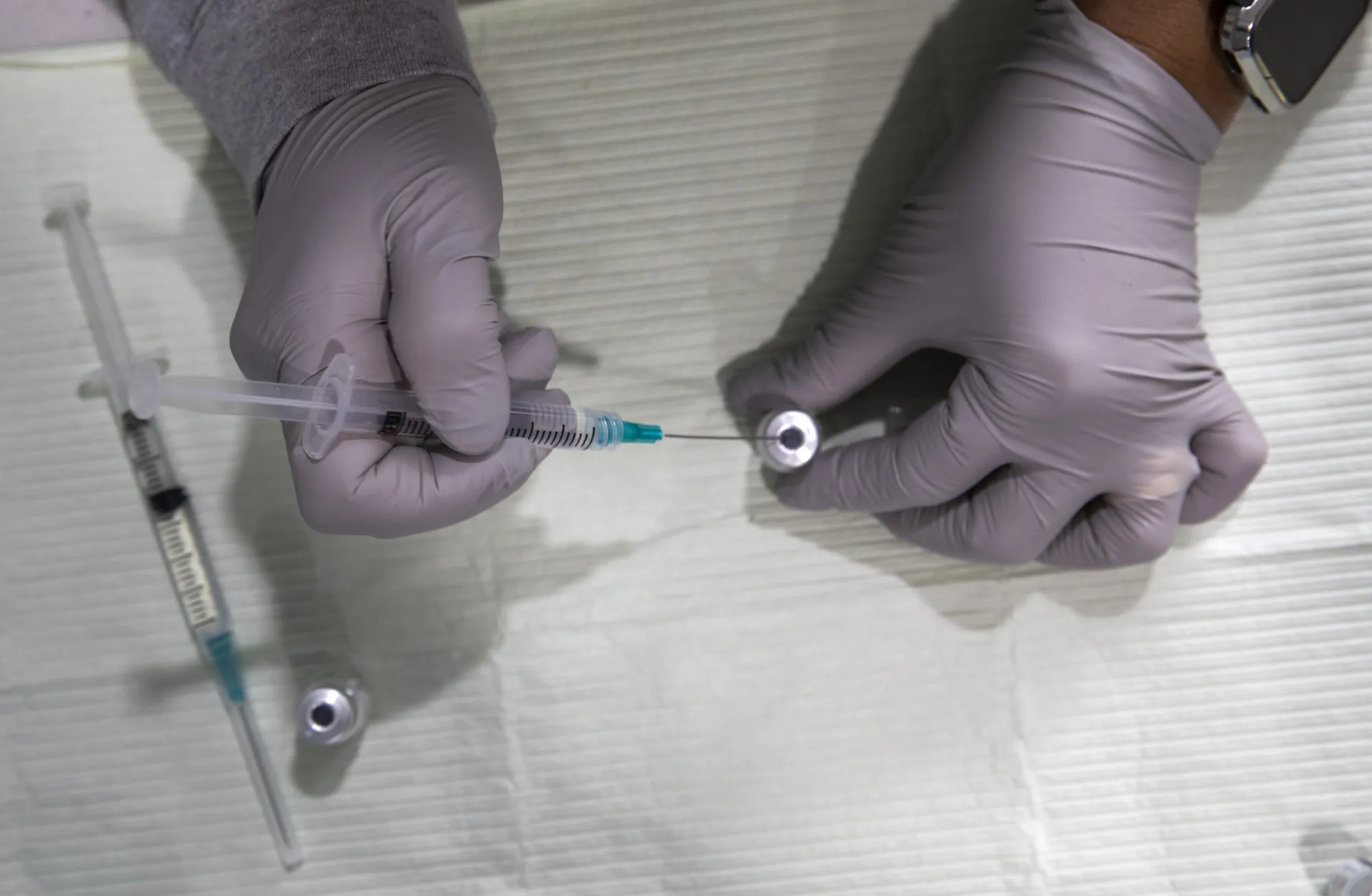 Get a Covid shot, lower your health bill? It could work.