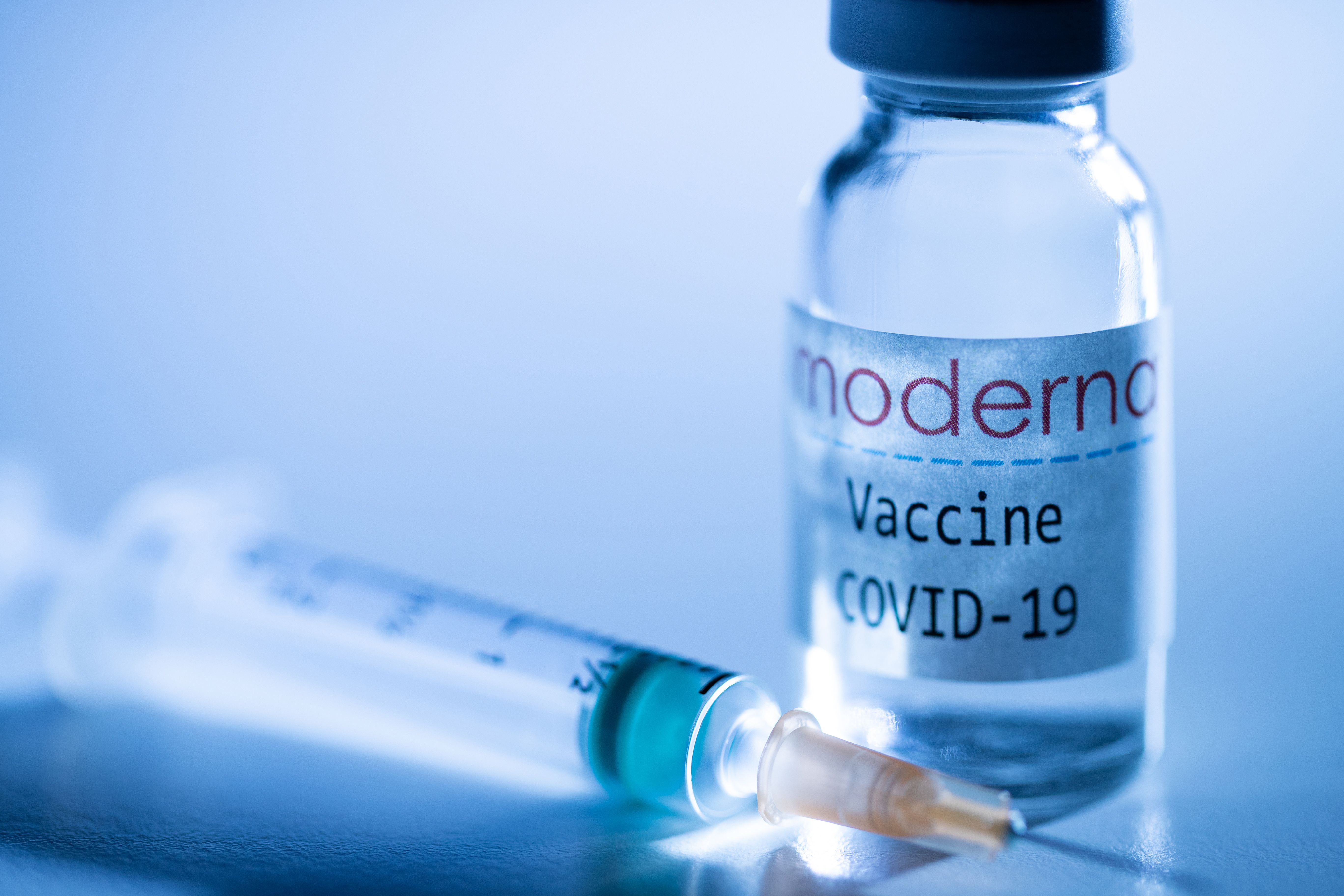 Moderna Pfizer Covid 19 Vaccines Side Effects Are Next Big Challenge Bloomberg