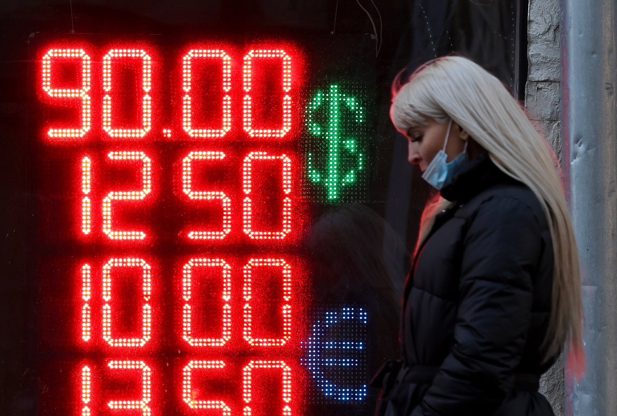Outside a Moscow exchange bureau Monday. As the Ukraine invasion sinks in, so does the ruble.