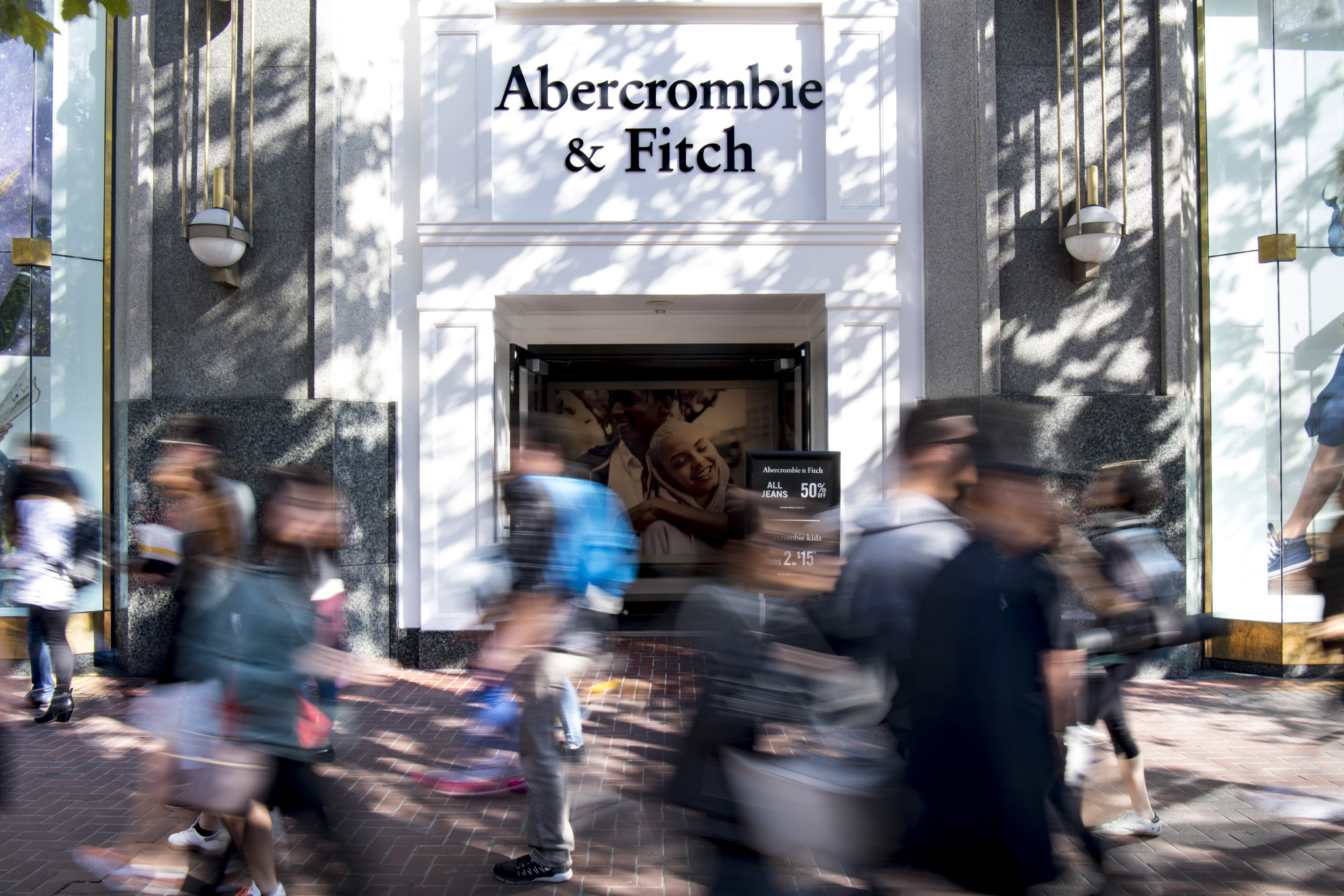 Pedestrians pass in front of an Abercrombie &amp; Fitch Co. store in San Francisco, California.