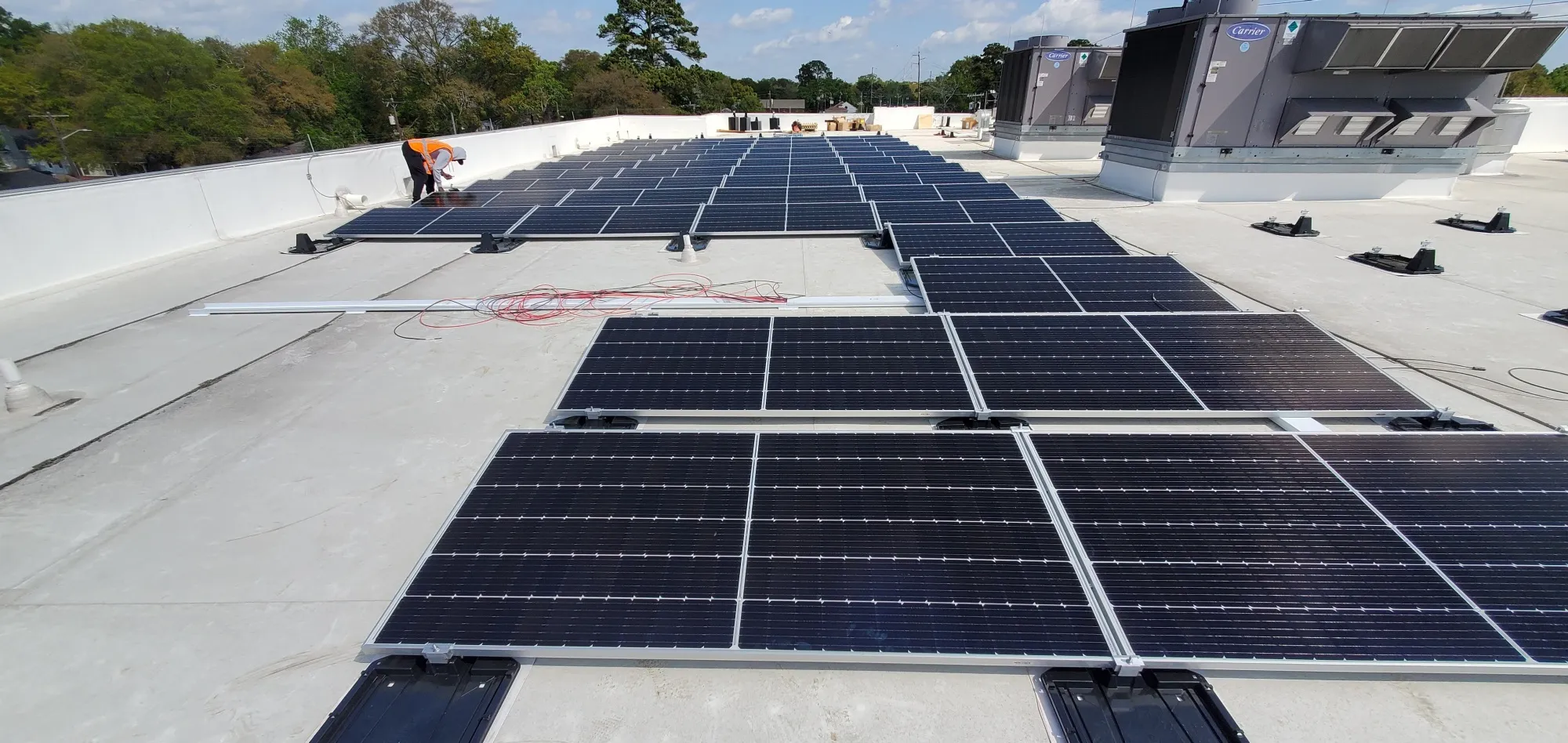 Solar panels atop the Pennsylvania Avenue Resource Center, a city building in Savannah, were installed using solar trainees from a workforce training program.