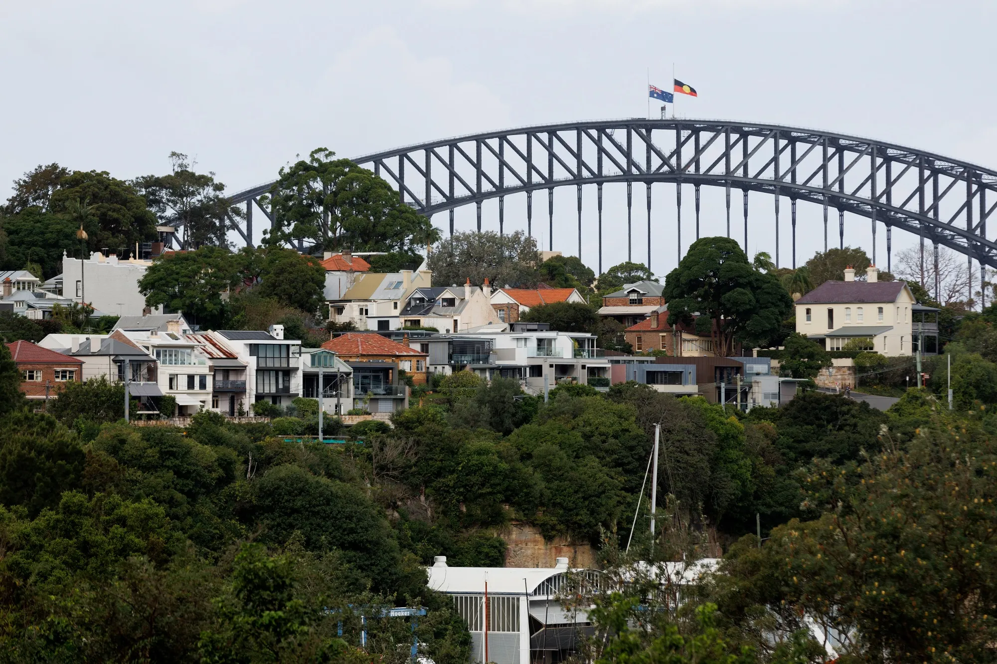 Houses in front of the Sydney Harbour Bridge in Sydney.