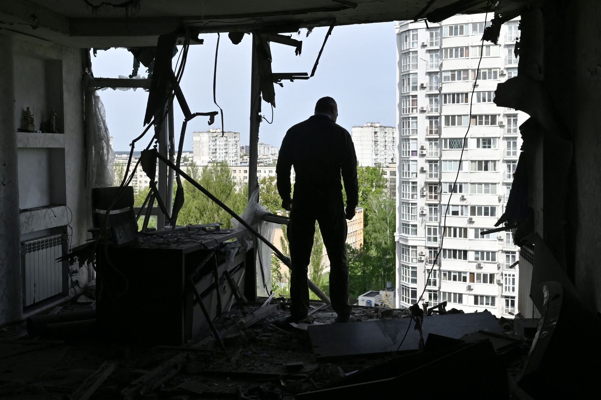 Vitali Klitschko, mayor of Kyiv, inspects the damage to a high-rise residential building by the remains of a shot down Russian drone in the city, May 8.