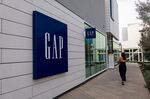 A person walks in front of a Gap Inc. store in Corte Madera, California.