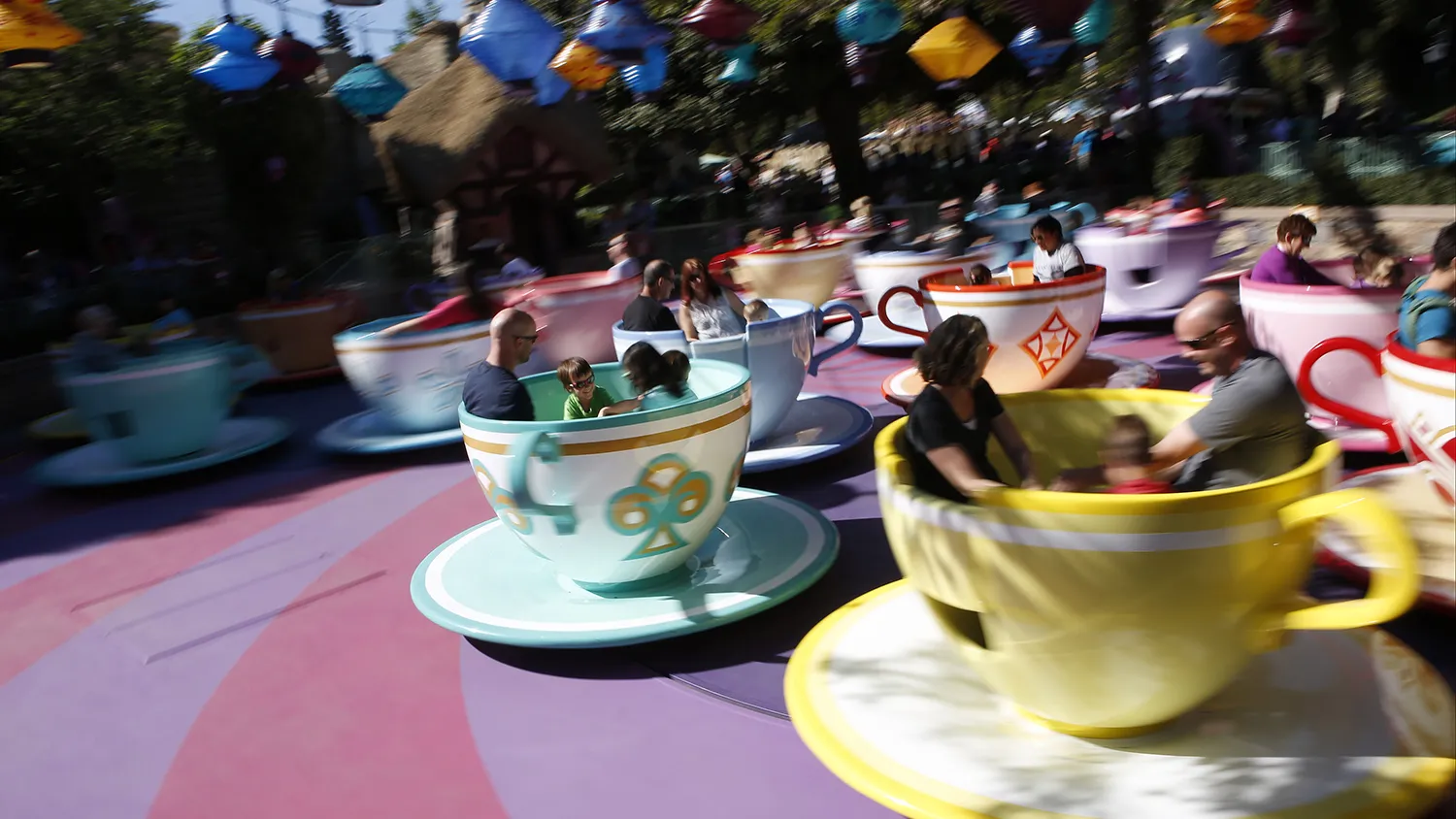 Guests ride the Tea Cups at Walt Disney Co.'s Disneyland Park, part of the Disneyland Resort, in Anaheim, California, U.S., on Wednesday, Nov. 6, 2013. The Walt Disney Co. is scheduled to release earnings figures on Nov. 7.
