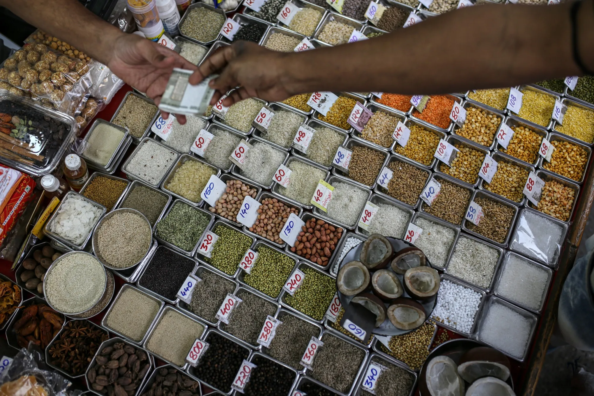 Pulses with price tags on display at a grocery store in Mumbai, India.