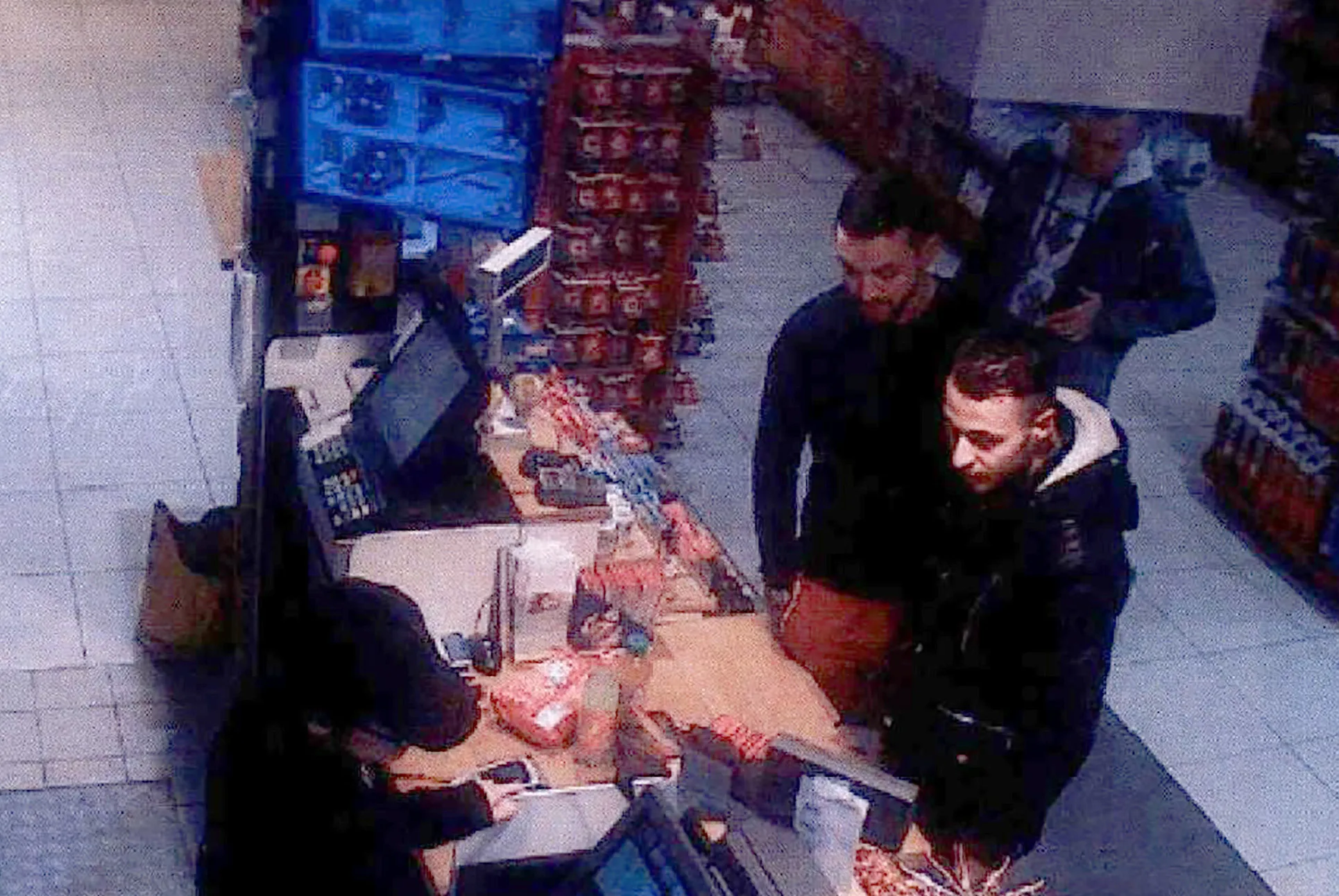 This video image taken from a CCTV camera at a petrol station in Ressons, North of Paris, on Nov. 11, 2015 shows Salah Abdeslam (right) and Mohamed Abrini (center) buying goods.
