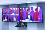Charles Michel, right, Ursula von der Leyen, Angela Merkel and Xi Jinping hold a video conference on Sept. 14.