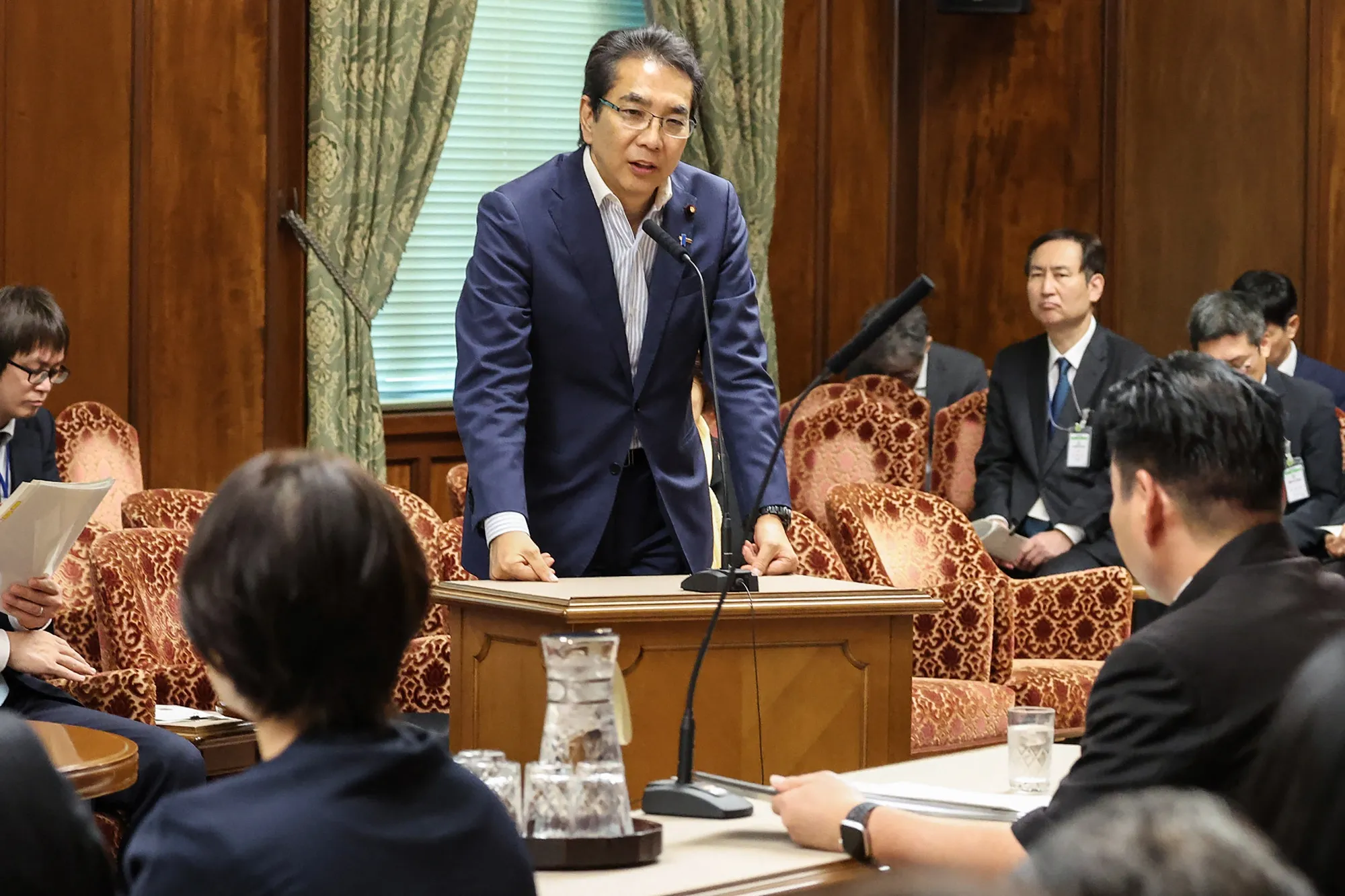 Taku Eto, center, at the parliament in Tokyo on May 19.