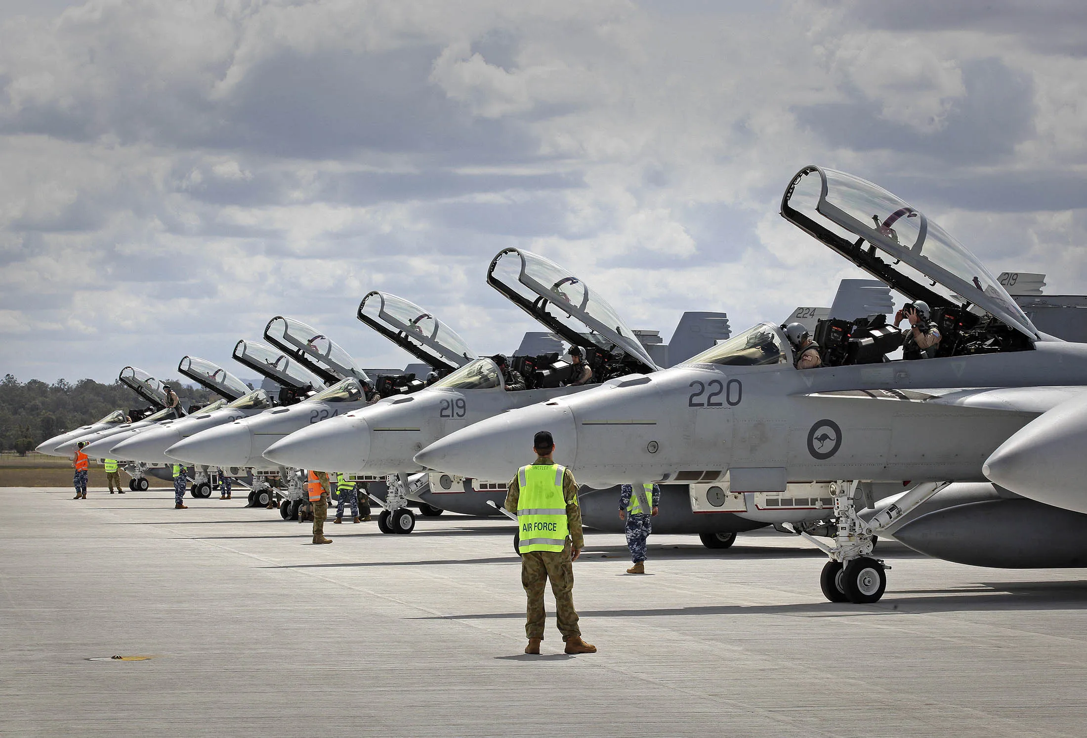 AMBERLEY, AUSTRALIA - SEPTEMBER 21: In this handout image provided by Commonwealth of Australia, ground crew assist as RAAF F/A-18F Super Hornets prepare for departure to the Middle East from RAAF Base Amberley on September 21, 2014 in Amberley, Australia. The main contingent of Royal Australian Air Force personnel and aircraft has departed for the Middle East today. Approximately 600 troops will be based on standby in United Arab Emirates for action in Iraq.
