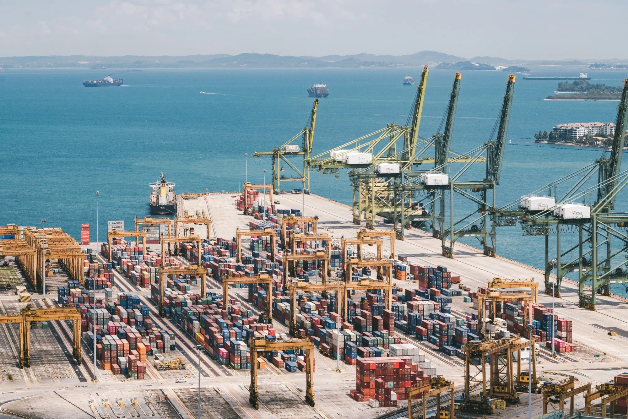 Shipping containers stand on the quayside at Singapore port in Singapore.