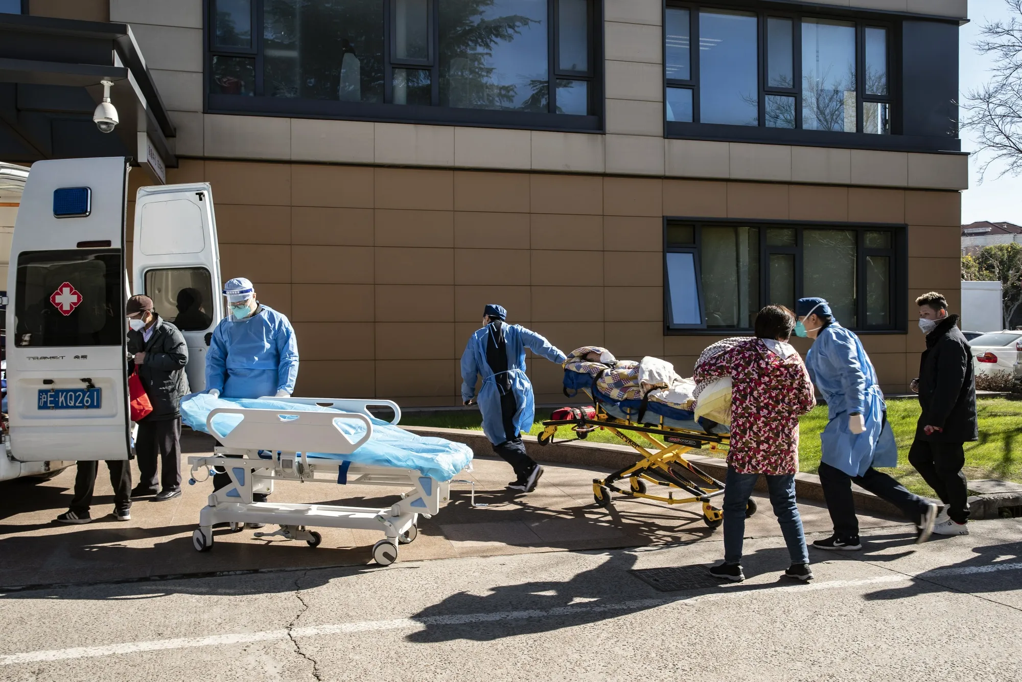 Health workers in protective gear transport a patient into the emergency room of a hospital in Shanghai, China, during a spike in Covid cases last year. New research points to the virus wrecking havoc on the gastrointestinal tract in some people.&nbsp;