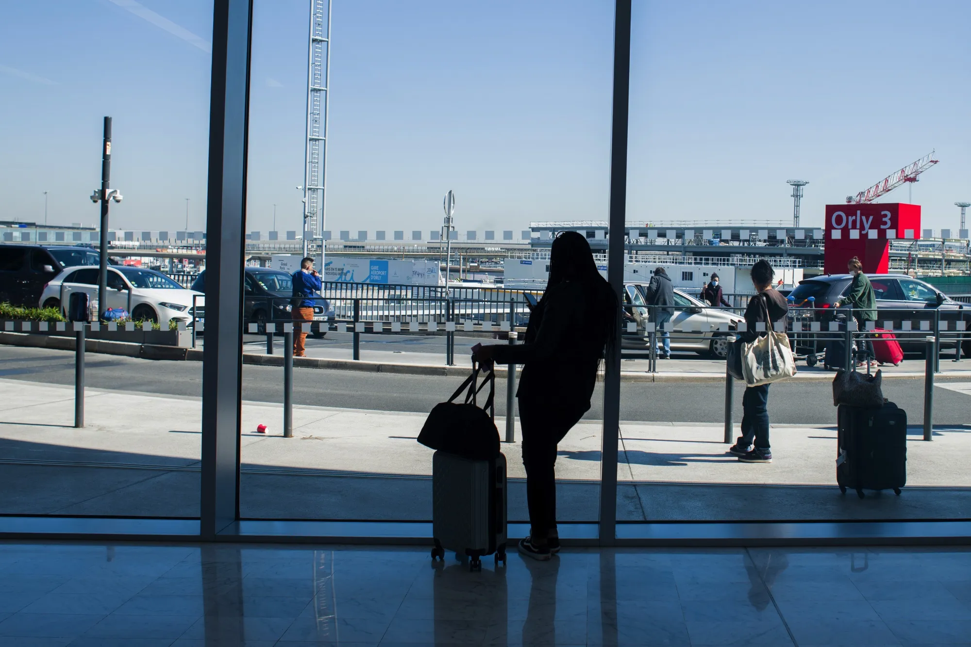A traveler uses a smartphone in Terminal 3 of Orly Airport, on April 27.